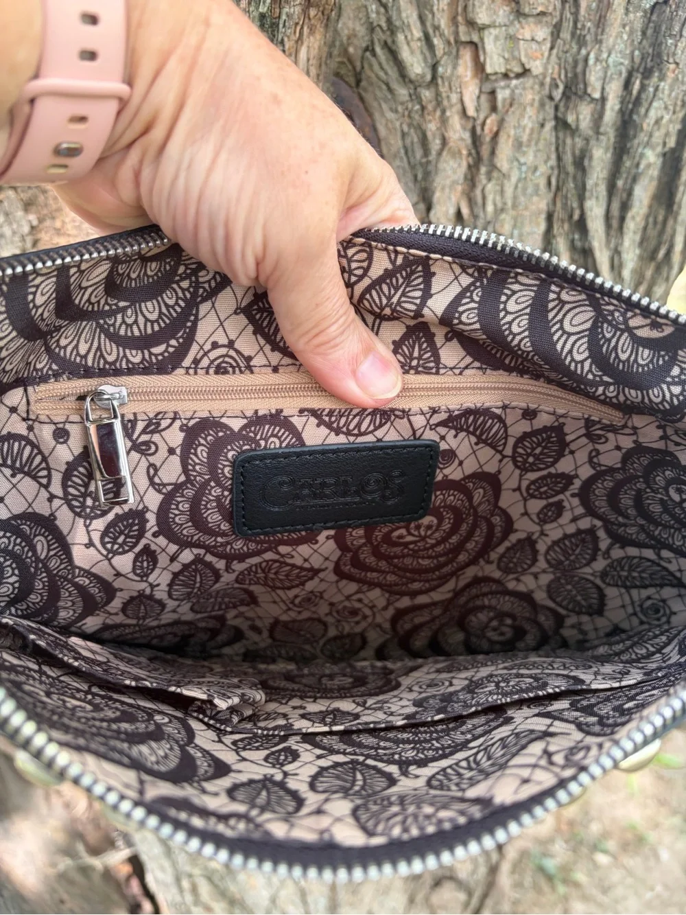 Carlos Santana Black And Silver Studded Women’s purse With Wristlet Strap.